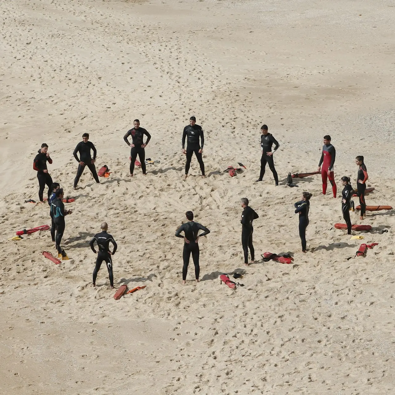 people standing forming a circle during daytime